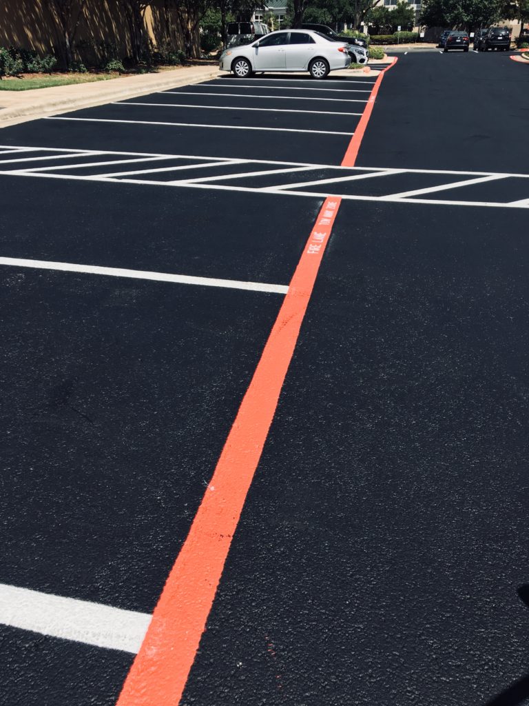 Seal coating and striping parking lot